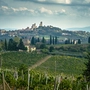 Panoramic view of vineyard against sky medieval tuscany town san gimignano italy