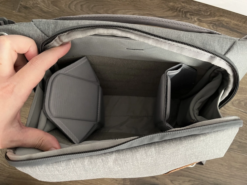 The inside​​​​​ of the bag with two dividers and an 11" tablet pocket