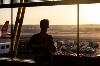 Silhouette of a guy at aiport
