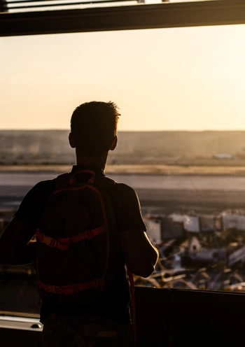 Silhouette of a guy at airport