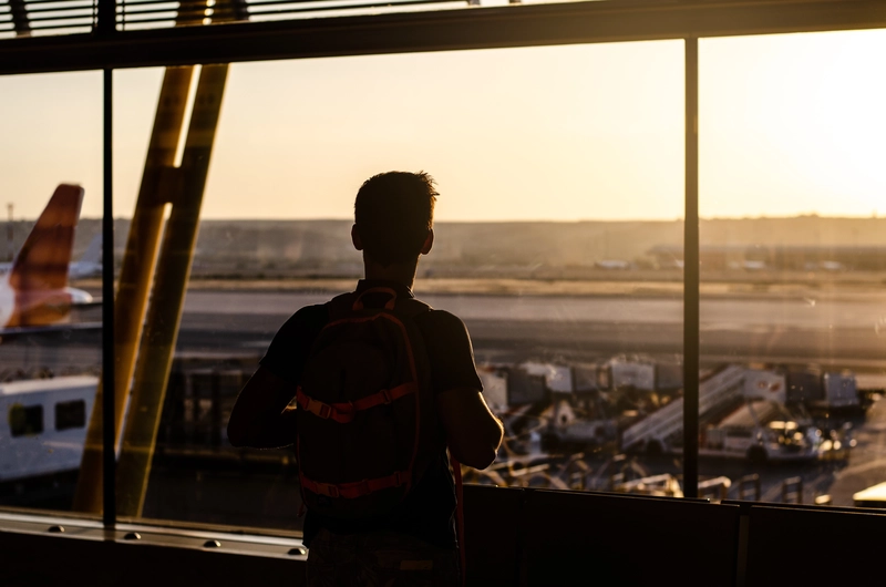 Silhouette of a guy at airport