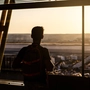 Silhouette of a guy at airport